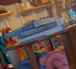 Product display at The Artful Ewe of 3 copies of Knitting Comfortably by Carson Demers. Photo credit Heidi Dascher.